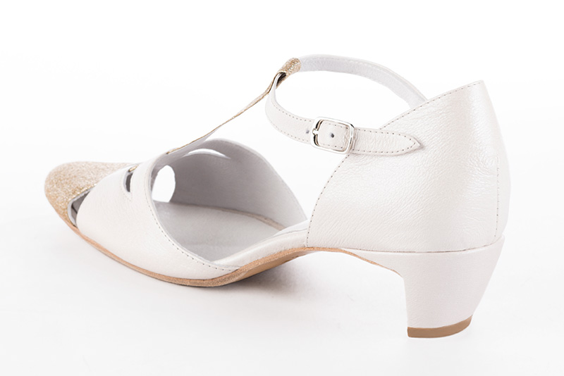 Gold and off white women's T-strap open side shoes. Round toe. Low comma heels. Rear view - Florence KOOIJMAN